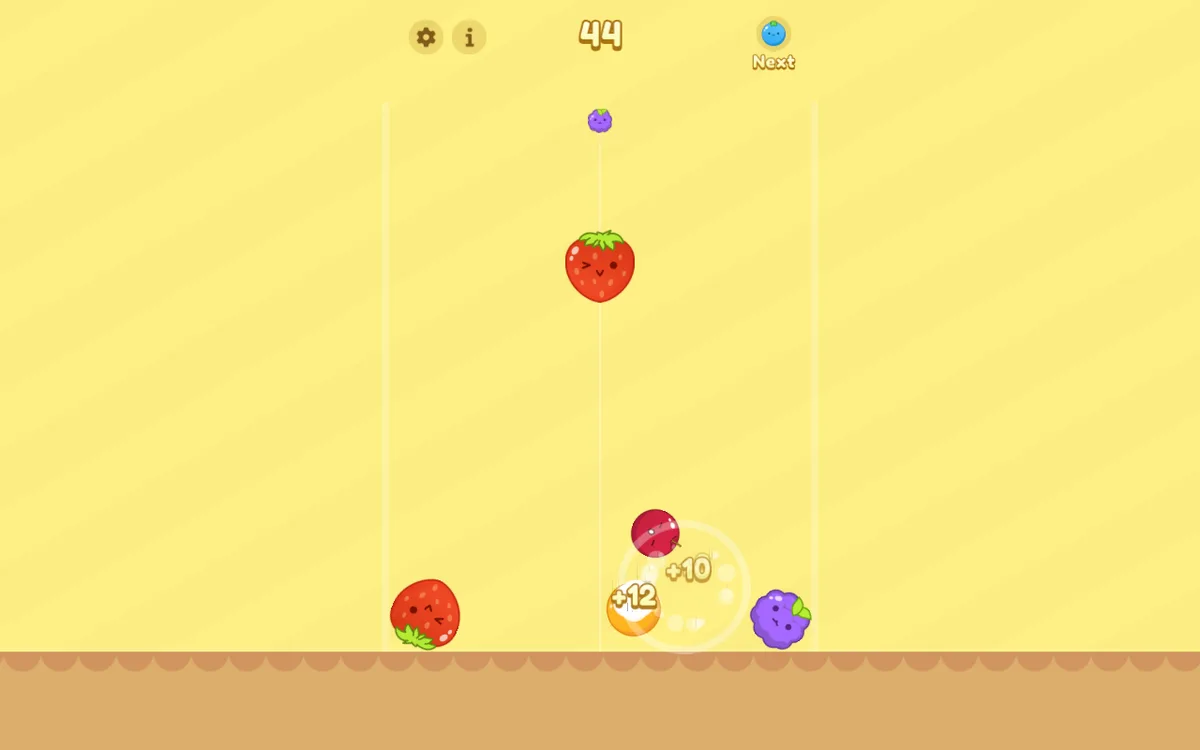 Score bubbles over a small fruit pile in Watermelon Fruit 2048