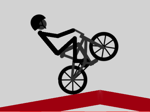 A silhouetted cyclist balancing on the rear wheel on a red slope